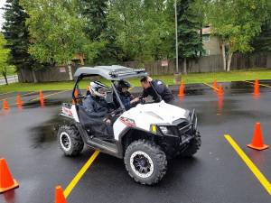 Homer PD&rsquo;s Sgt. Ryan Browning (right) talks to a teen driver while he traverses a course with Officer Jim Knott (left) at a Project Drive clinic they put on in Anchorage. The department has put hundreds of students through the anti-drunk driving educational clinic since it began in 2011. (Photo courtesy Ryan Browning)