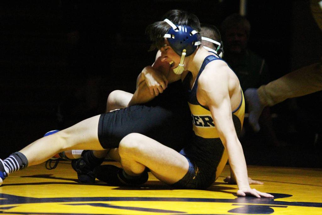 Junior wrestler Seth Inama grapples with Colony&rsquo;s Vinna Cramer during a Senior Night dual between the teams Thursday, Nov. 30, 2017 in the Alice Witte Gymnasium in Homer, Alaska. (Photo by Megan Pacer/Homer News)