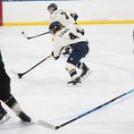 Homer&rsquo;s Lee Lowe skates with the puck, pursued by several Colony High School players, during their hockey game Friday, Dec. 1, 2017 at Kevin Bell Arena in Homer, Alaska. The Mariners beat Colony 2-1, and swept the Mat-Su Valley teams over the weekend, winning all three of their games. (Photo by Megan Pacer/Homer News)
