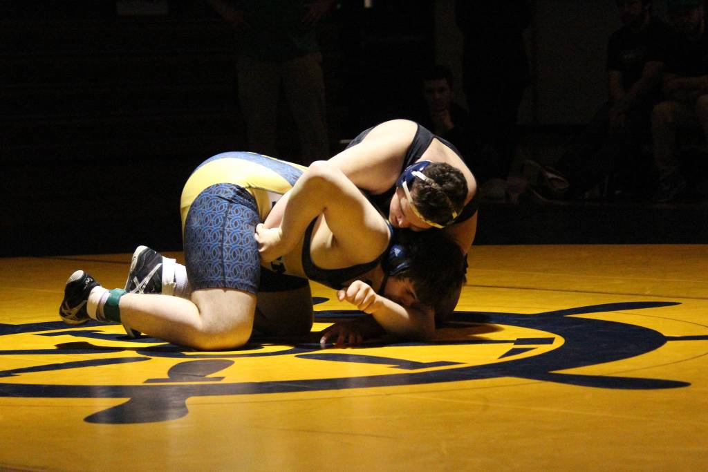 Homer&rsquo;s Richard Brock struggles to break free from Colony High School&rsquo;s Brandon Holmes during a wrestling match Thursday, Nov. 30, 2017 at the Alice Witte Gymnasium in Homer, Alaska. (Photo by Megan Pacer/Homer News)