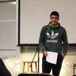 Pedro Ochoa, the assistant cross-country team coach, reads a sonnet he wrote during a Coffee House event held Tuesday, Dec. 5, 2017 at Pioneer Hall on Kachemak Bay Campus in Homer, Alaska. The event was put on by the school&rsquo;s Student Association and was an opportunity for student, many of whom were taking a creative writing class, to share their work aloud in public. (Photo by Megan Pacer/Homer News)