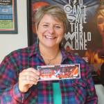 Homer Theatre manager Colleen Carroll holds up a ticket to the Homer premiere of &ldquo;Star Wars: The Last Jedi&rdquo; after tickets went on sale Saturday, Dec. 2, 2017 at the theatre in Homer, Alaska. The gala opening night is Dec. 14. (Photo by Michael Armstrong, Homer News)