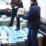 U.S. Coast Guard Cutter Naushon crew member James Bannon, right, helps Homer Safeway assistant store manager Tiffany Biggs, center, load Hunger Bag food onto a truck, Dec. 5, 2017. Bannon and fellow crew member Jordan Dorchin delivered food to the Homer Community Food Pantry on Tuesday that had been purchased by Safeway customers as part of its Hunger Bag project. Store Manager Bob Malone said about 1,300 bags at $10 each had been sold at the Homer store since Nov. 1. Through a national program, Safeway sells the bags and donates food to charities chosen by local stores. Pallets of food are organized at the Anchorage warehouse and sent to Homer. &ldquo;This year, from what I understand, the need is more than normal,&rdquo; Malone said. (Photo by Michael Armstrong, Homer News)