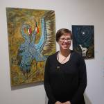 Amy Kruse poses for a photo at a First Friday reception on Dec. 1 2017 at Fireweed Gallery in Homer, Alaska. (Photo by Michael Armstrong, Homer News)