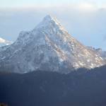 The bear in the side of Poot Peak has emerged for the winter after snow fell on the mountain Friday, Dec. 8, 2017 in Homer, Alaska, highlighting the image of of a head, nose and eyes. (Photo by Michael Armstrong, Homer News)