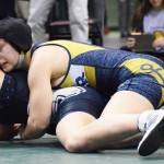 Homer&rsquo;s McKenzie Cook holds down Madison Ellis of South Anchorage Saturday night at the Girls State Wrestling Championships at the Alaska Airlines Center in Anchorage. (Photo by Joey Klecka/Peninsula Clarion)