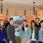 Photo by Michael Armstrong/Homer News New and returning members of the Homer Chamber of Commerce and Visitor Center board of director pose in front of a poster of the new chamber tourism guide after the chamber&rsquo;s annual meeting on Tuesday at the Best Western Bidarka Inn. From left to right are Tom Soderholm; Alita Martin; Nelton Palma; Kari Dendurent; Jenny Carroll, advisory member representing the City of Homer; Melanie Dufour; Patrick Mede; Adrienne Sweeney; Keri-Ann Baker, President; and Brad Conley. A full house of members attended the annual meeting. Chamber director Debbie Speakman introduced new and returning board members and announced the winners of the chamber&rsquo;s photo contest. Board President Baker also unveiled the cover of the 2018 tourism and recreation guide, with an image of a soaring eagle by photographer Collin Walker.