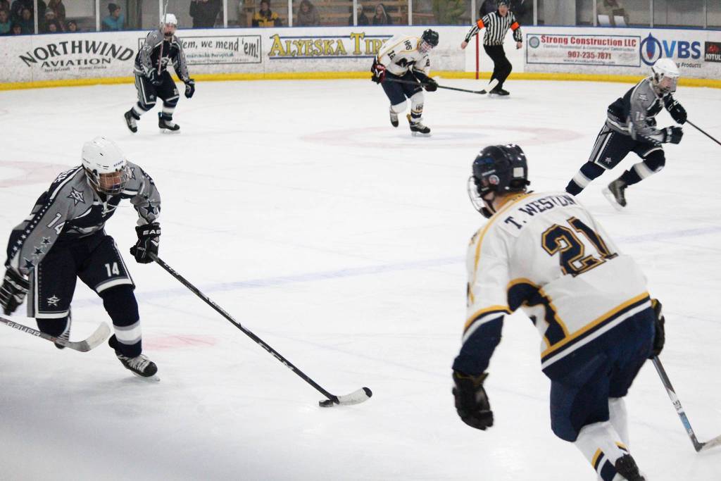 Homer&rsquo;s Tucker Weston moves to block Soldotna&rsquo;s Alex Montague as he skates down the rink with the puck during their Tuesday, Jan. 16, 2017 game at the Kevin Bell Arena in Homer, Alaska. The Mariners rolled over the Stars 10-1. (Photo by Megan Pacer/Homer News)