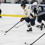Senior Dimitry Kuzmin skates the puck down the rink during the Homer Mariners&rsquo; game against Soldotna High School on Tuesday, Jan. 16, 2018 at the Kevin Bell Arena in Homer, Alaska. The Mariners trounced the Stars 10-1. (Photo by Megan Pacer/Homer News)