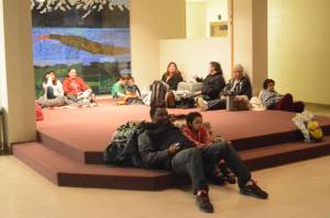 Absulair Salam, his daughter Mina, and their pets wait inside during Homer High School during the tsunami evacuation. About 40 people and four dogs and two cats waited inside, with another 50 vehicles parked in the lot. (Photo by Michael Armstrong, Homer News)