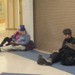 Jan Knutson, left, and Ed Hutchinson wait at Homer High School during a tsuanami evacuation early Tuesday. About 50 cars and trucks Ѡincluding a few motorhomes Ѡparked at Homer High School during the tsunami evacuation. Another 40 people and four dogs and two cats waited inside. (Photo by Michael Armstrong, Homer News)