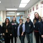 Twenty Homer High School students attended six FOL, Focus On Learning, sessions sponsored by Homer Marine Trades, but these four received HMT sweatshirts for having completed all six sessions. The topics covered a variety of marine-related career subjects. From left: student Skyler Bond, Lucinda Martin Wells of Fargo Bank, student Grace Godfrey, Kate Mitchell of NOMAR, student Jonah Socha, FOL coordinator Reba Temple, and student Shyanne Sallee. (Photo provided. )