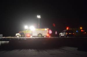 Homer Volunteer Fire Department firefighters and Homer Police responded about 6 p.m. Monday, Jan. 22, to a single-vehicle rollover at the east end of Beluga Lake. EMTs in an Argo ATV drove out to the scene to treat and transport the male victim to the staging area at the bottom of the float plane launch ramp near the Homer Airport. According to police, the rollover ejected the man from the truck. The crash is not related to an earlier incident on Monday where a truck got stuck in thin ice on the northeast end of the lake. In that incident, Alaska Department of Fish and Game officials said the driver had strayed into the Homer Airport Critical Habitat area, an area prohibited to motorized vehicles. (Photo by Michael Armstrong, Homer News)