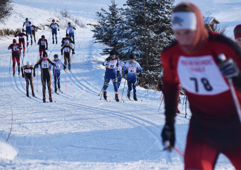 Kenai Central&rsquo;s Karl Danielson (78) leads a pack of boys varsity racers, including Soldotna&rsquo;s Josh Shuler (84) and Homer&rsquo;s Denver Waclawski (90) up an early hill Friday afternoon in the Kenai Klassic races at the Tsalteshi Trails in Soldotna. (Photo by Joey Klecka/Peninsula Clarion)