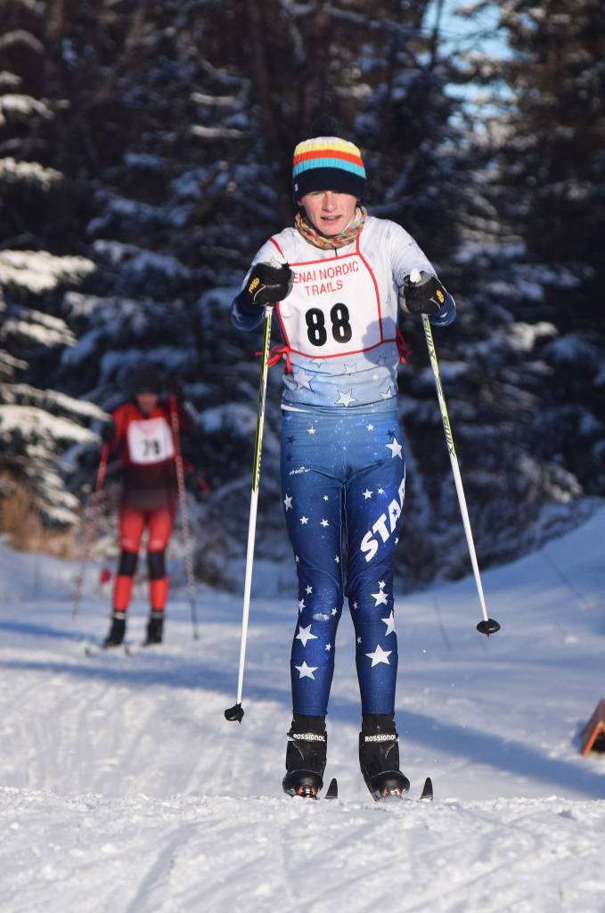 Soldotna&rsquo;s Lance Chilton makes his way out of the forest Friday afternoon in the Kenai Klassic races at the Tsalteshi Trails in Soldotna. (Photo by Joey Klecka/Peninsula Clarion)