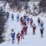 The field of girls varsity racers climb up a hill early in the Kenai Klassic races Friday afternoon at the Tsalteshi Trails in Soldotna. (Photo by Joey Klecka/Peninsula Clarion)