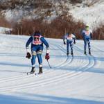 Homer&rsquo;s Denver Waclawski leads two Soldotna High School skiers to the finish line of the varsity boys 5 kilometer classic race Friday, Feb. 2, 2018 at the Lookout Ski Trails near Homer, Alaska. Waclawski took third in the race. (Photo by Megan Pacer/Homer News)