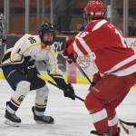 Homer&rsquo;s Isaiah Nevak attempts a move around Wasilla&rsquo;s Devin Carney Friday in a North Star Conference tournament semifinal at the Soldotna Regional Sports Complex. (Photo by Joey Klecka/Peninsula Clarion)