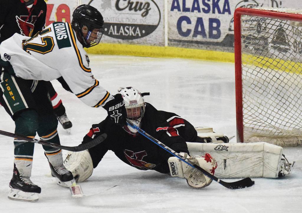 Kenai Central goalie Josh Tree blocks a shot from Colony&rsquo;s Tae&rsquo;jean Evans Friday in a North Star Conference tournament semifinal at the Soldotna Regional Sports Complex. (Photo by Joey Klecka/Peninsula Clarion)