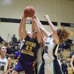 Homer&rsquo;s Maggie Box (23) battles for a rebound with Nikiski&rsquo;s Kaycee Bostic (right) Saturday, Feb. 3, 2018 at Nikiski High School. (Photo by Joey Klecka/Peninsula Clarion)