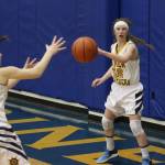 Homer&rsquo;s Alissa Cole passes the ball to Rylyn Todd durng the girls team&rsquo;s first game in the Homer Winter Carnival Tournament on Thursday, Feb. 8, 2018 at the Alice Witte Gymnasium in Homer, Alaska. (Photo by Megan Pacer/Homer News)