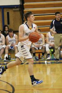 Homer&rsquo;s Cody Etzwiler dribbles the ball down the court during the boys team&rsquo;s first game of the Homer Winter Carnival Tournament on Thursday, Feb. 8, 2018 at the Alice Witte Gymnasium in Homer, Alaska. (Photo by Megan Pacer/Homer News)