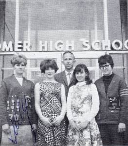 The 1968 Homer High School Mariner Girl Ski Team poses for a photo in 1968 in front of the old high school, now the Homer Education and Recreationa Complex. From let to right are Sally Barnet, Sharon Cooper, Coach David Schroer, Linda Poindexter and Gayle Gregory. (Photo provided by Larry Martin)