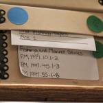 A box of audio recordings rests on a shelf in the cultural collections room of the Pratt Museum on Thursday, Feb. 15, 2018 in Homer, Alaska. (Photo by Megan Pacer/Homer News)