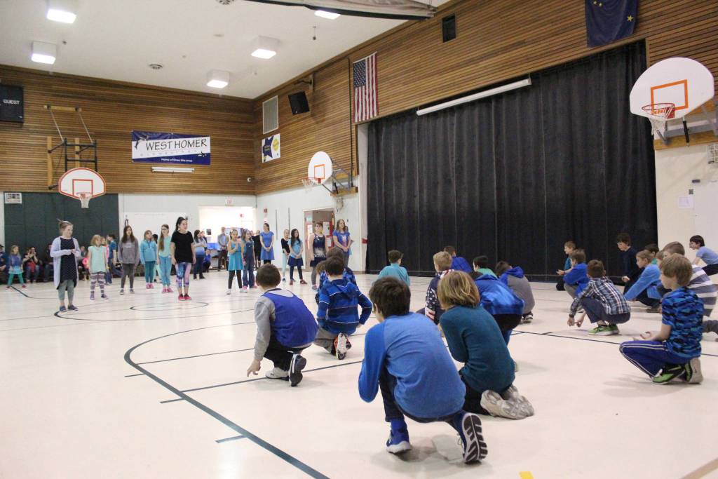 Students perform one o the dances they learned from Artist in the School resident Jocelyn Shiro during a recital for parents Friday, Feb. 23, 2018 at West Homer Elementary School in Homer, Alaska. (Photo by Megan Pacer/Homer News)