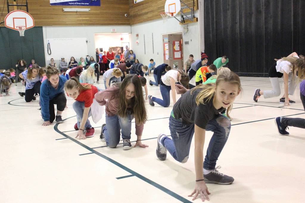 Students perform one o the dances they learned from Artist in the School resident Jocelyn Shiro during a recital for parents Friday, Feb. 23, 2018 at West Homer Elementary School in Homer, Alaska. (Photo by Megan Pacer/Homer News)