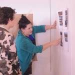 Artist in Residence Jaimie Warren, right, discusses her art project with Alex Franklin, left at her temporary studio at Bunnell Street Arts Center. The Brooklyn, New York, artist visits Homer this month. (Photo by Michael Armstrong, Homer News)