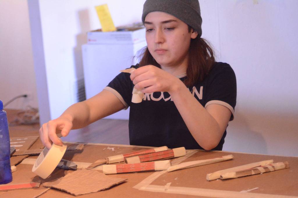 ABOVE: Mila Stickrod works on an art project Monday, March 5, 2018, at Jaimie Warren&rsquo;s residency at Bunnell Street Arts Center in Homer, Alaska. The Brooklyn, New York, artist visits Homer, Alaska, this month. (Photo by Michael Armstrong / Homer News)