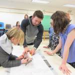 Tim Blackman with the Alaska Department of Fish and Game helps Lukas Renner and Esme Golden dissect a salmon Thursday, March 1, 2018 at Fireweed Academy in Homer, Alaska. (Photo by Fireweed Academy Principal Todd Hindman)