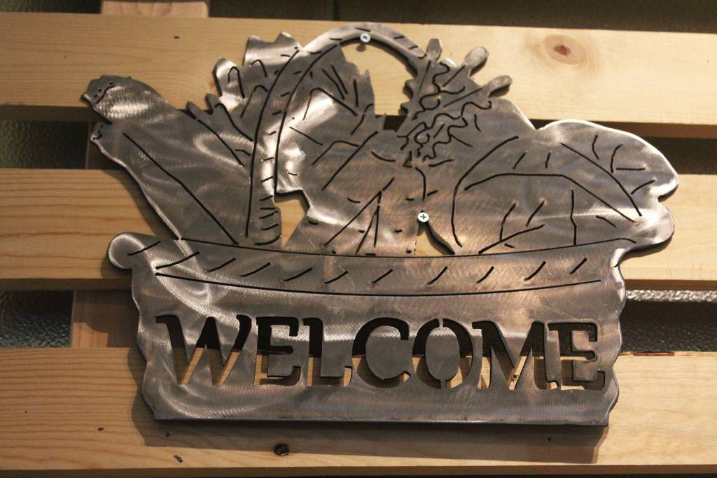 A piece of art created by Homer High School teacher Lauren Seaton hangs on display during a First Friday art show Friday, March 2, 2018 at Grace Ridge Brewery in Homer, Alaska. Works of art created by her Computer Aided Drafting and Computer Aided Manufacturing program students were the subject of the show. (Photo by Megan Pacer/Homer News)