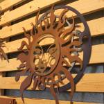 A metal sculpture depicting a sun and moon hands along with several other creations during a First Friday art show Friday, March 2, 2018 at Grace Ridge Brewery in Homer, Alaska. All the art on display during the show was created by students in Homer High School&rsquo;s Computer Aided Drafting and Computer Aided Manufacturing program. (Photo by Megan Pacer/Homer News)
