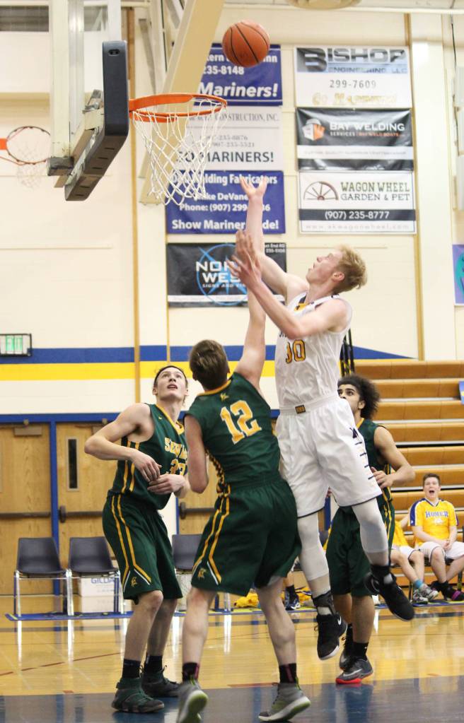 Homer&rsquo;s Japheth McGhee makes a shot for the Homer Mariners boys&rsquo; basketball team during the Senior Night game against Seward High School on Friday, March 2, 2018 in Homer, Alaska. (Photo by Megan Pacer/Homer News)