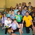 Photo by Christine Kulcheski Kachemak Swim Club swimmers who competed at Age Groups in Juneau pose with their medals and ribbons on Feb. 22 at the Kate Kuhns Aquatic Center in Homer.