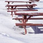 Fresh snow covers picnic tables at Mariner Park Campground on the Homer Spit, Alaska, on Sunday, March 11, 2018. (Photo by Michael Armstrong, Homer News)