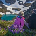 Mary Frische, lef, and Tom Collopy, right, look out on one of the scenic Alaska vistas they photographed with their business, Wild North Photography. (Photo provided)
