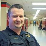 Kenai Police Officer Dan Smith, school resource officer and investigator, at Kenai Central High School on March 5. Smith acts as a liaison between law enforcement and the schools. (Photo by Erin Thompson/Peninsula Clarion)