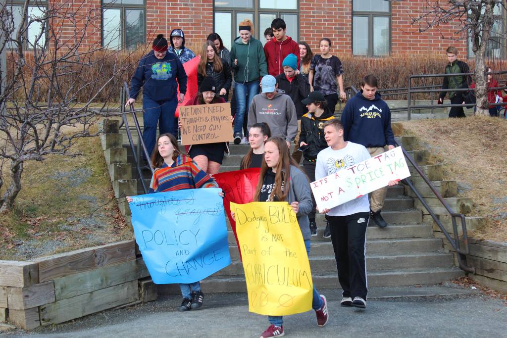 Students walk out of Homer High School on Wednesday, Feb. 21, 2018 during a demonstration to advocate for safer schools and honor those killed in the Valentine&rsquo;s Day mass shooting in Pakrland, Florida. (Photo by Megan Pacer/Homer News)