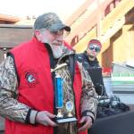 Charlie Edwards of the Optimist holds his trophy after winning this year&rsquo;s Winter King Salmon Tournament on Saturday, March 24, 2018 on the Spit in Homer, Alaska. His winning fish weighed 24.6 pounds. (Photo by Megan Pacer/Homer News)