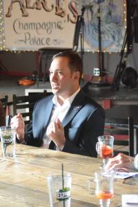 Dimitri Shein speaks to about 15 people at Alice&rsquo;s Champagne Palace on Monday, March 26, in Homer, Alaska. (Photo by Michael Armstrong, Homer News)