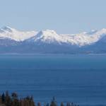 Why we live here, reason number 1 The Homer Spit and the Kenai Mountains glow in the later afternoon sun as seen from the Baycrest Hill turnout on Monday, April 2, 2018, in Homer, Alaska. The spectacular view off the Sterling Highway seen as people round the corner heading south has led to more than a few people settling in Homer. (Photo by Michael Armstrong/Homer News)