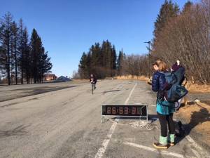 Laura Inama crosses the finish line first in the 2.6 mile category in the first ever Trot to the Top event held by the Homer High School soccer team over the weekend in Homer, Alaska. (Photo by Karin Sonnen)