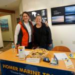 Cinda Martin, left, and Jennifer Mitchell Hakala, right, staff the Homer Marine Trades booth during the Kachemak Bay Campus College and Career Fair last Friday, March 30, 2018 in Homer, Alaska. About 400 students from 11 area schools as well as community members visited the annual event, said Kim Frost, KBC student and enrollment services coordinator. &ldquo;Our focus is to get the younger people interested in training and employment,&rdquo; Mitchell Hakala said. (Photo by Michael Armstrong/Homer News)