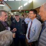South Peninsula Service Area Board members William Runnoe, left, Roberta Highland, center, back to camera, and Ralph Broshes, right, visit with new SPH CEO Joseph Woodin, second from right. Also listening is Robert Archibald, second from left. Woodin started work last month and attended an open house for the expanded and remodeled clinic last Friday, March 30, 2018 on Bartlett Street in Homer, Alaska. (Photo by Michael Armstrong, Homer News)