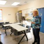 South Peninsula Hospital Board Inc. member Julie Woodworth gives a tour of the new break room at an open house for the expanded and remodeled clinic last Friday, March 30, 2018 on Bartlett Street in Homer, Alaska. (Photo by Michael Armstrong, Homer News)