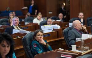 Members of the House of Representatives watch the vote on the state&rsquo;s operating budget bill at the Capitol on Monday, April 2, 2018. The House passed the bill along caucus lines. (Michael Penn