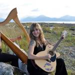 Michelle Morton, left, and Shawn Zuke, left, play harp and guitar at Bishop&rsquo;s Beach, Homer, Alaska. (Photo by Tim Steinberg)